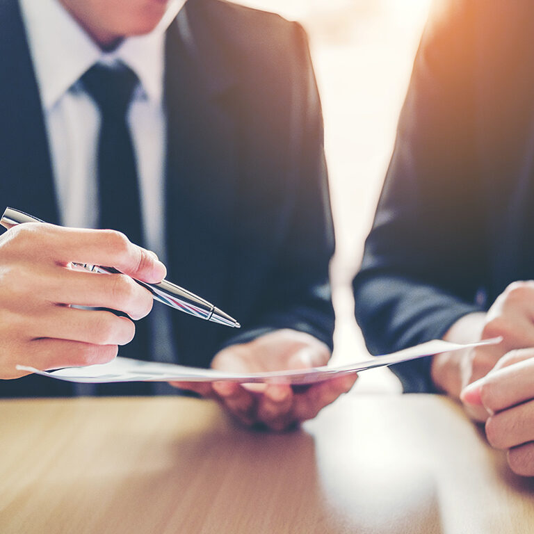 Business people Meeting negotiating a contract between two colleagues